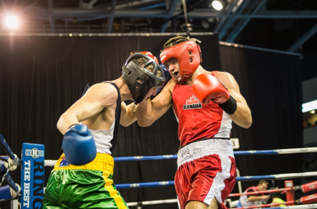 boxers in ring wearing headgear