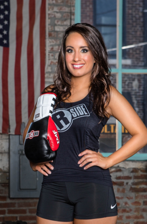 woman in workout gear with boxing gloves