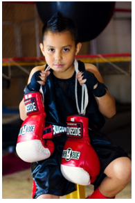 young boy pair boxing gloves