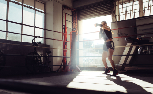 female shadow boxing in ring
