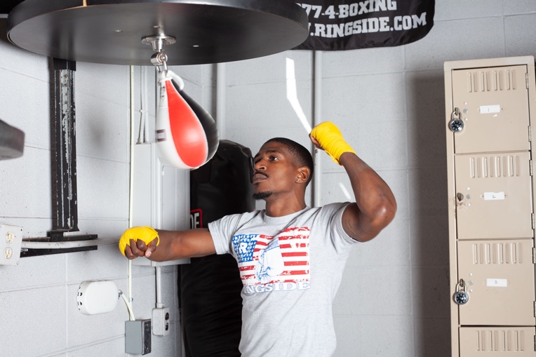 man hitting speed bag