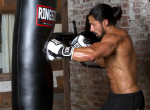 Hitting the heavy bag is a key element of boxing training.