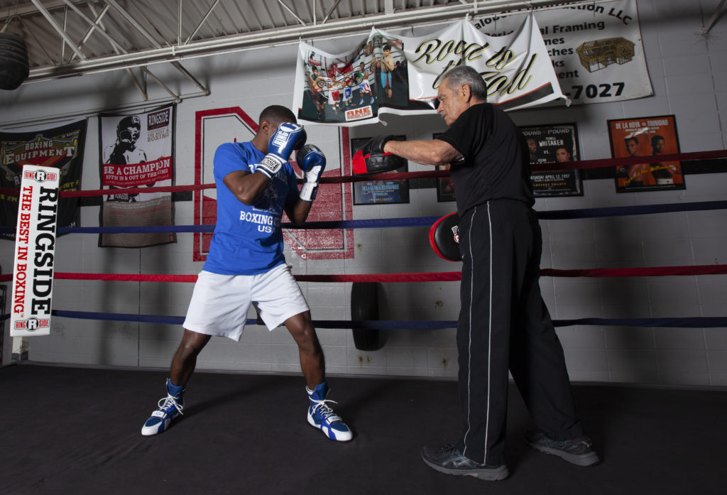 Boxer in ready stance doing mitt work