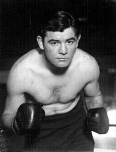 James J. Braddock posing for a picture with gloves on.