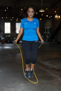 Using a speed rope to jump rope before a boxing workout