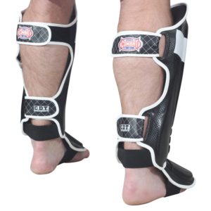 the back side of an adjustable strap shin guard