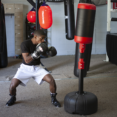 A boxer prepares to strike the Tornado Free-Standing Heavy Bag.