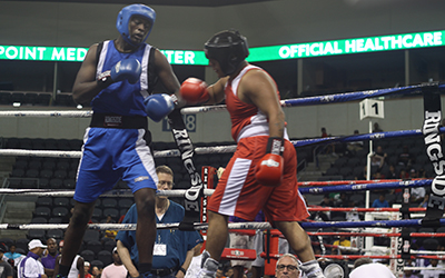 A tall boxer faces off against a shorter, more muscled opponent.