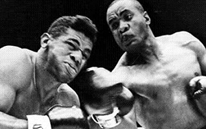 Sonny Liston hitting Floyd Patterson with hard shot from his right hand.